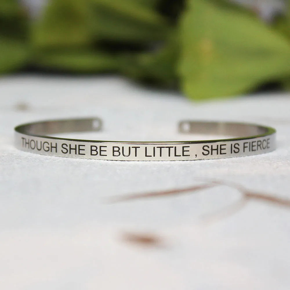 Silver customisable stainless steel bracelet with laser engraved text and adjustable fit on neutral background