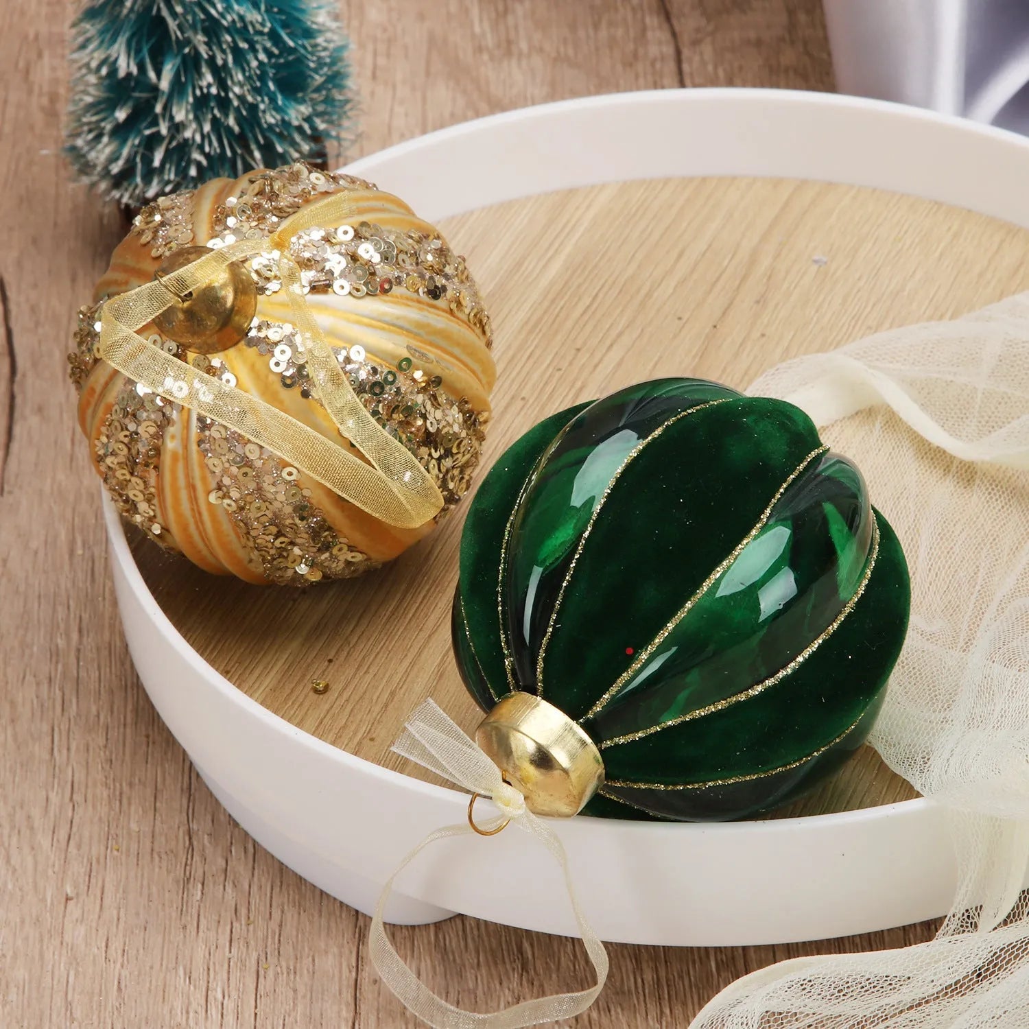 Green and yellow striped flocking Christmas glass ball decoration with mosaic surface on white background