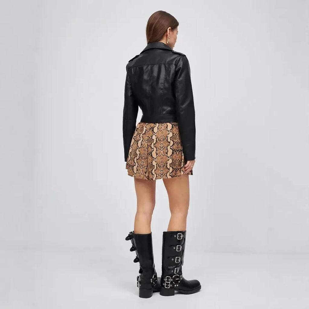 Black women's PU leather retro coat with regular sleeves on hanger