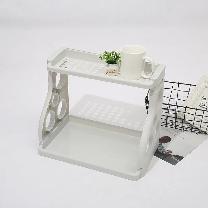 Foldable kitchen storage rack with multi-layer white shelving for organised kitchen supplies
