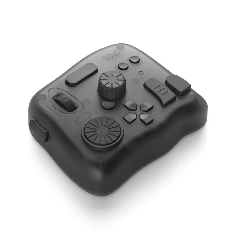 TourBox NEO black USB video editing controller and auxiliary keyboard on a desk