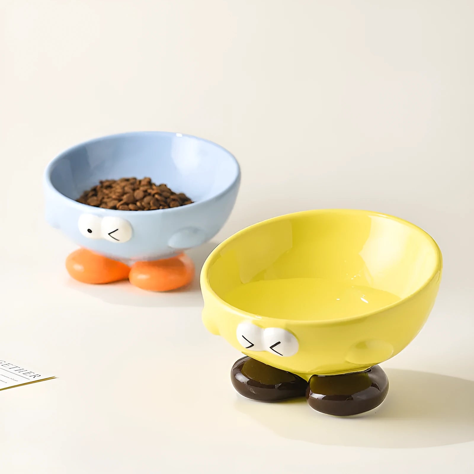 Blue oblique tall ceramic bowl for cat or dog food, designed for cervical spine support.