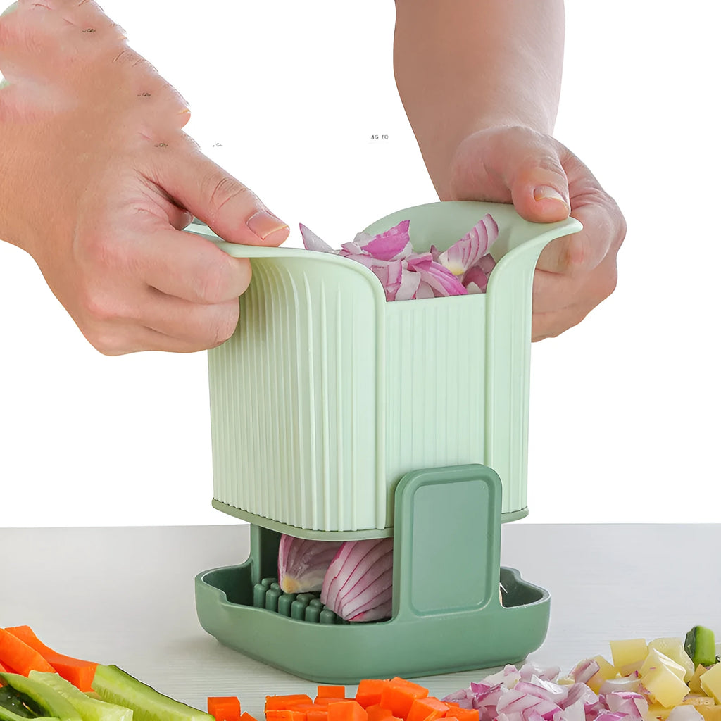 Green hand-operated vegetable chopper with stainless steel blades for slicing onions, potatoes, radishes and cucumbers