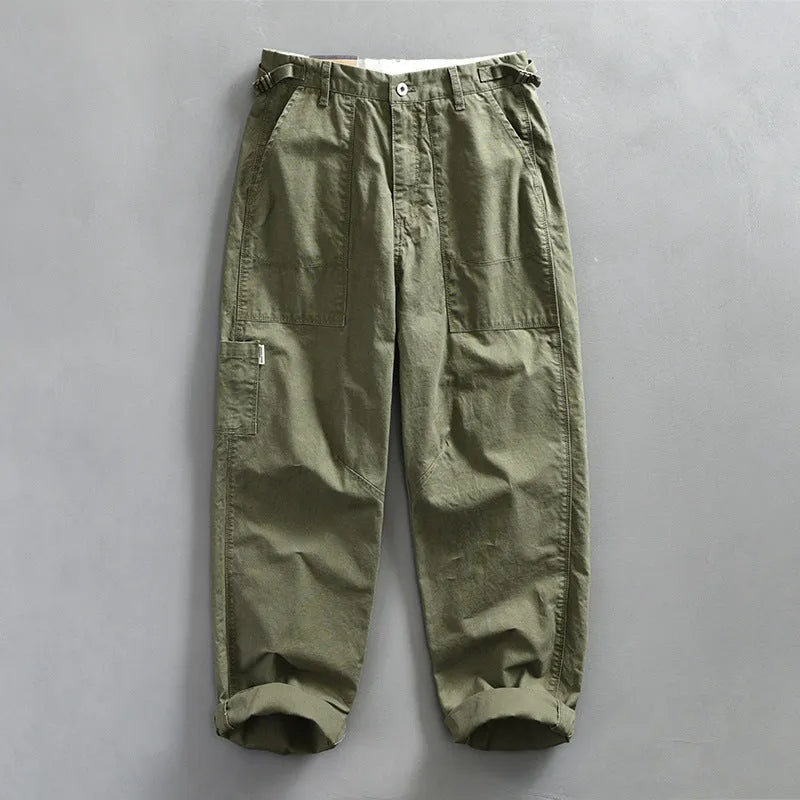 Men's straight leg cotton casual trousers in apricot, shown from the front.
