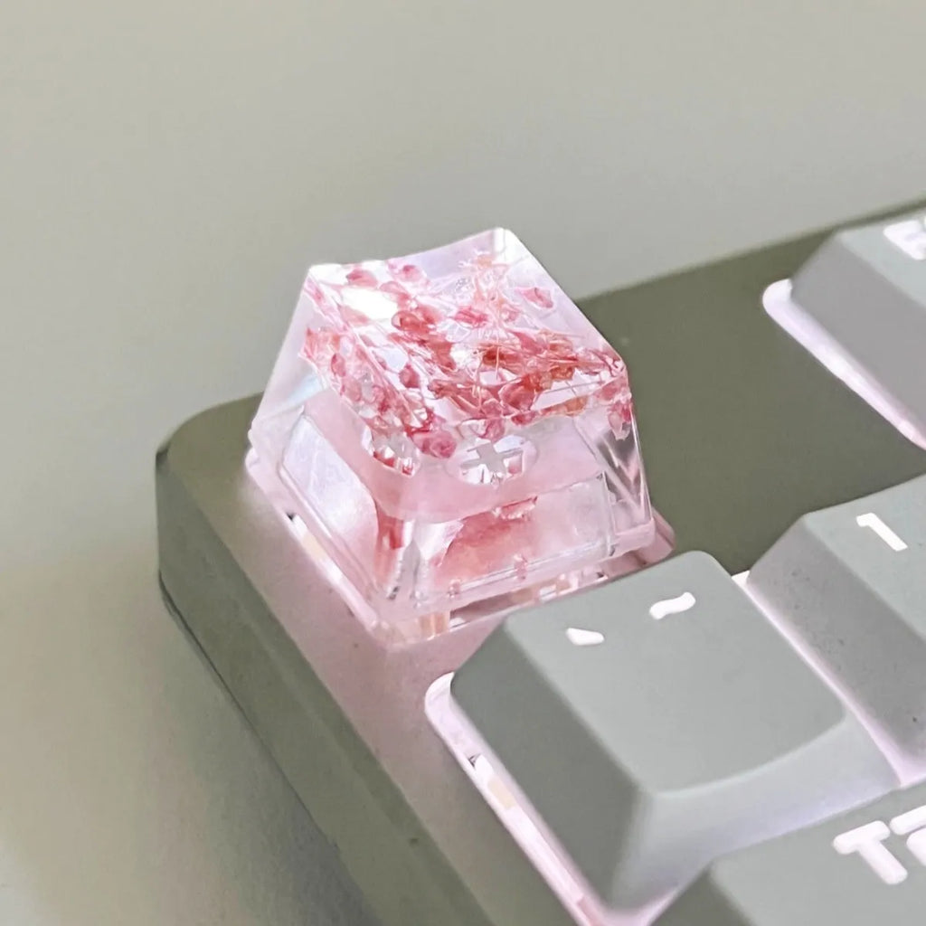 Transparent resin keycap with starry sky design in red, pink, green, or violet colours