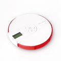 Blue 7-compartment alarm clock pill dispenser showing timer display and pill slots.