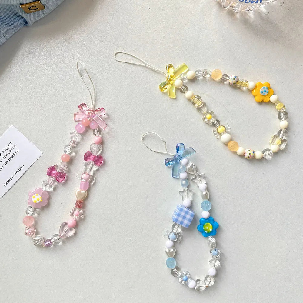 Beaded flower mobile phone lanyard with hand rope design in yellow, blue, or pink colour options