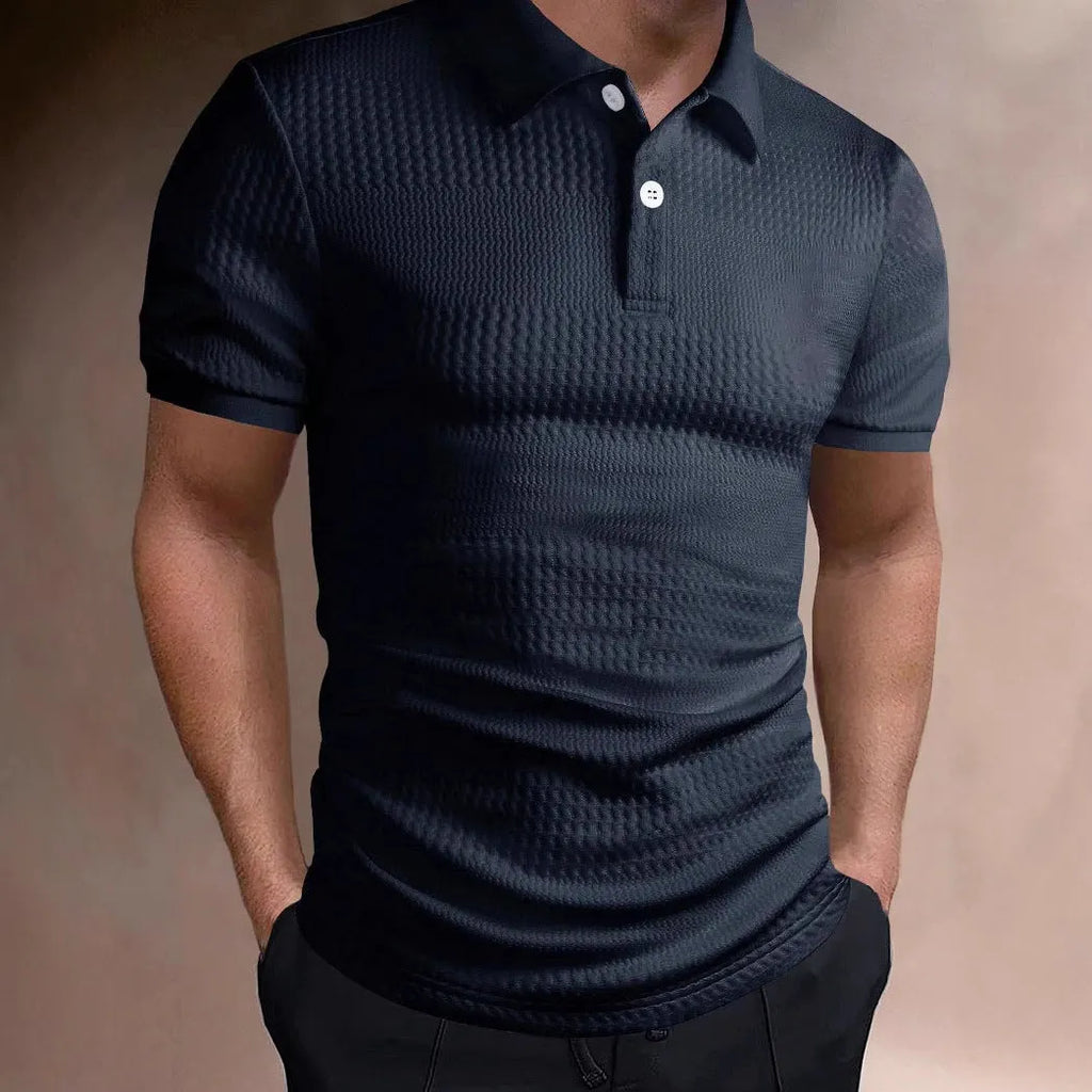 Man wearing a striped loose-fit polo shirt in light blue, showing short sleeves and asymmetric detail.