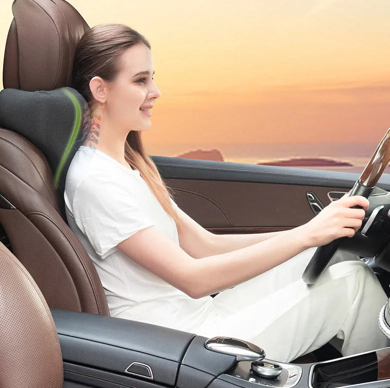 Dark gray universal car neck memory foam pillow on a car seat headrest.