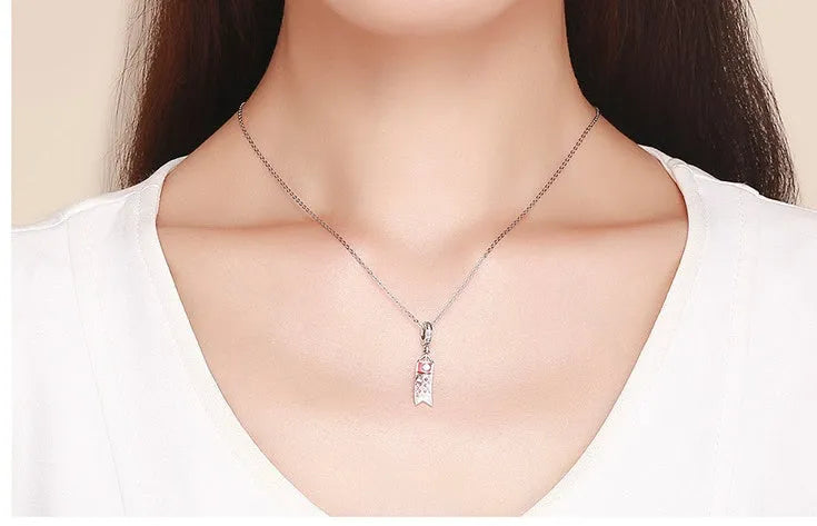 S925 sterling silver carp streamer pendant necklace with zircon stones and oxide detailing.