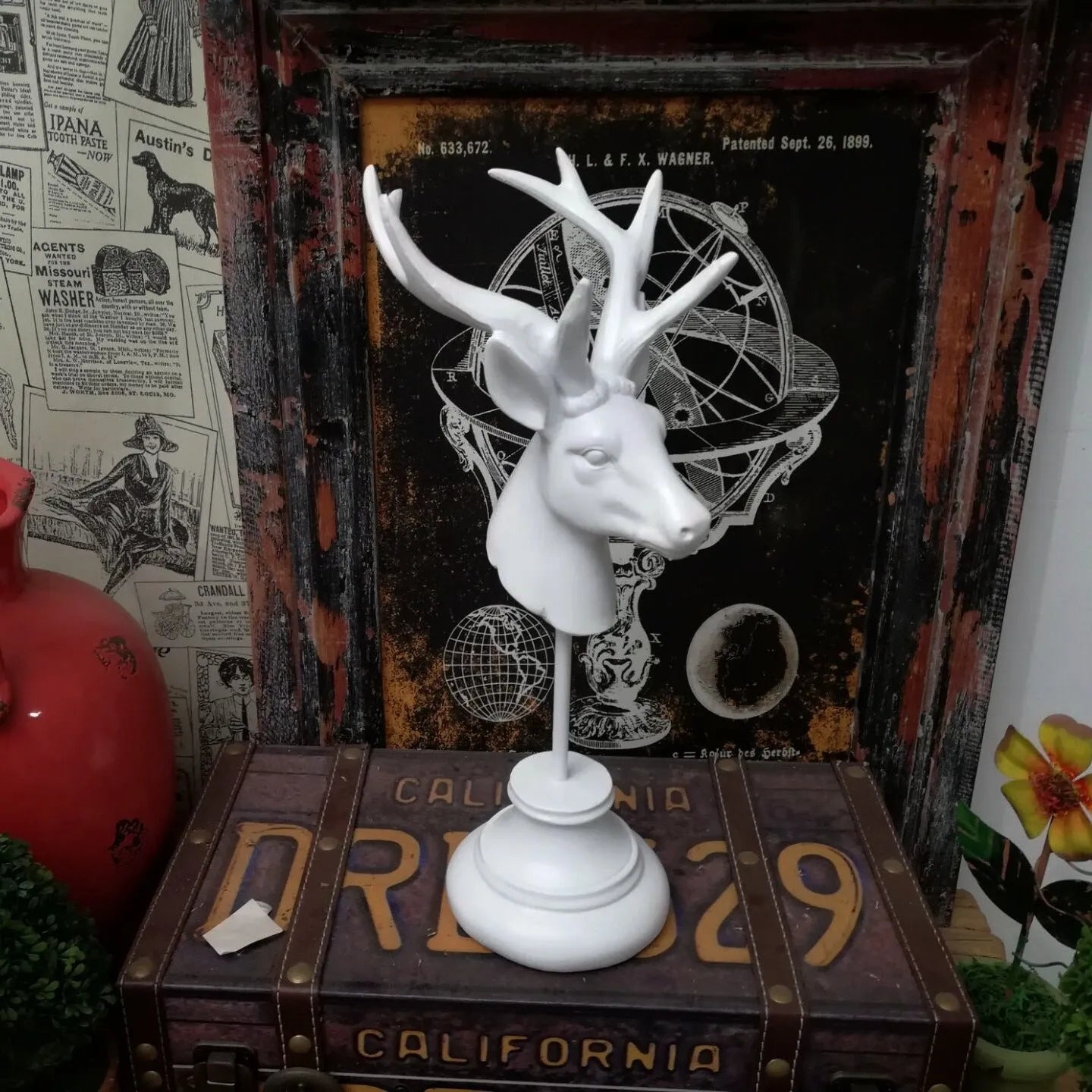 A tall black resin animal sculpture ornament for home decoration on a wooden surface.