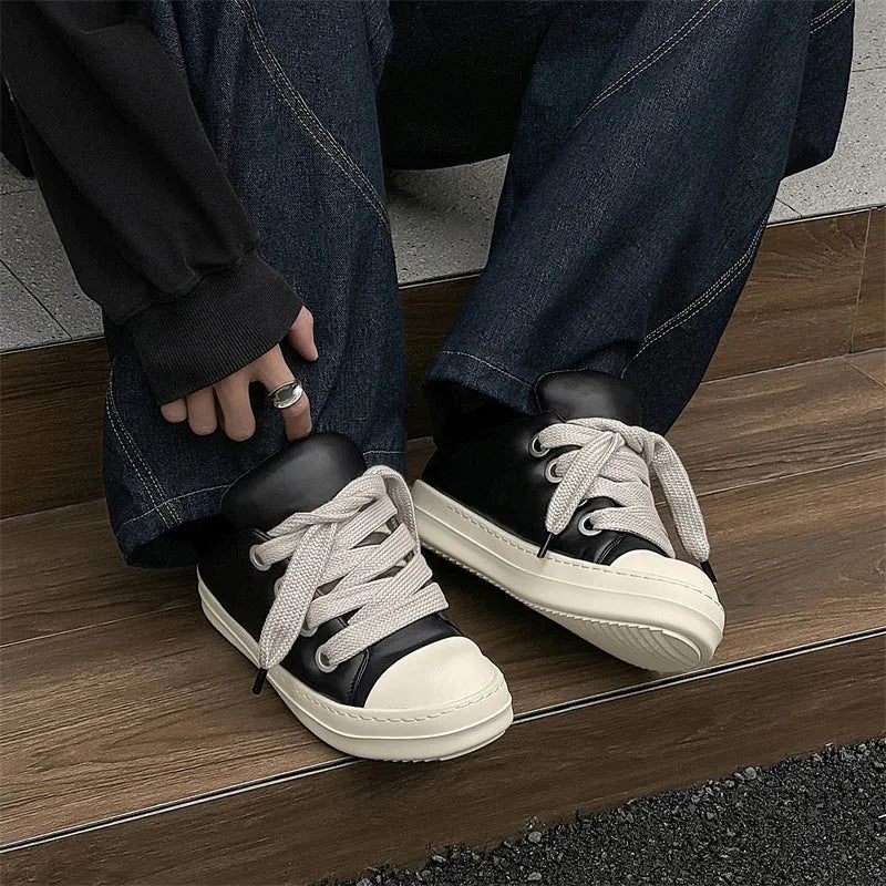 Men's black leather slip-on casual shoes with round toe and flat rubber soles