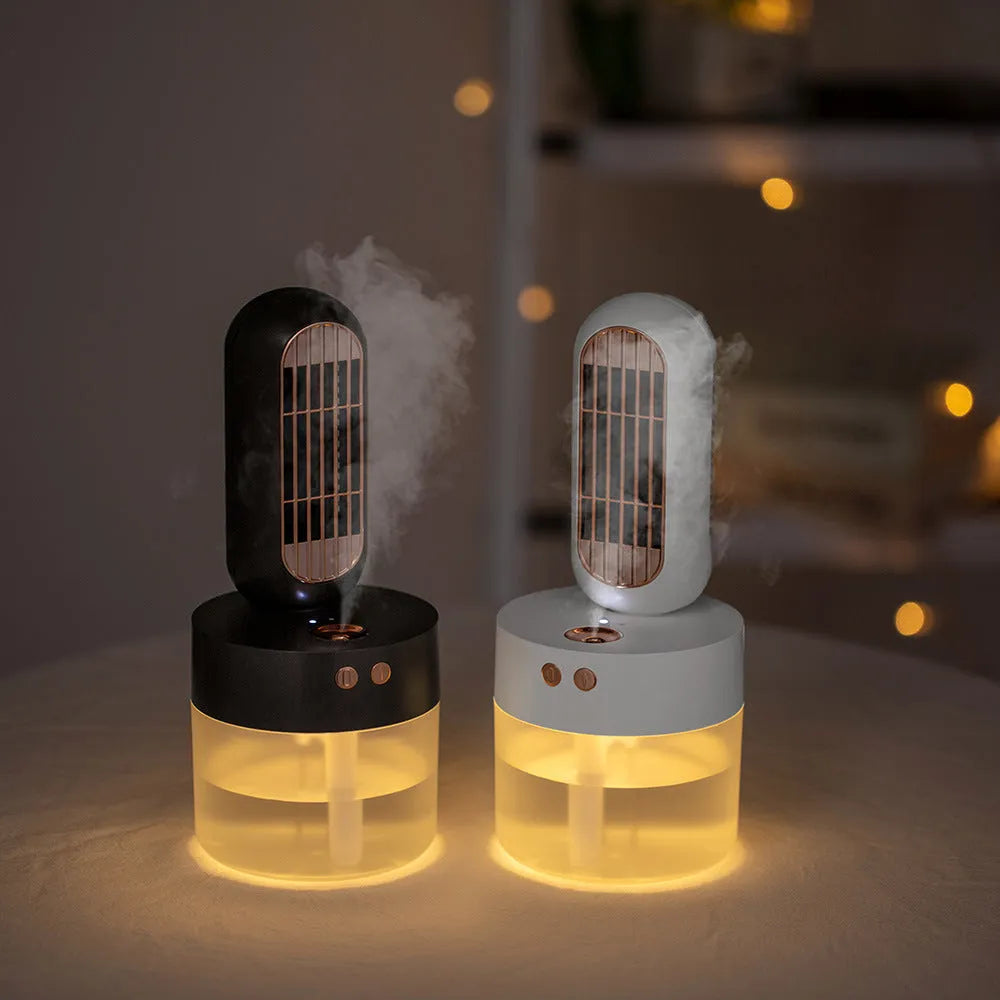 Small black and white portable humidifier fan with oscillating head on desk