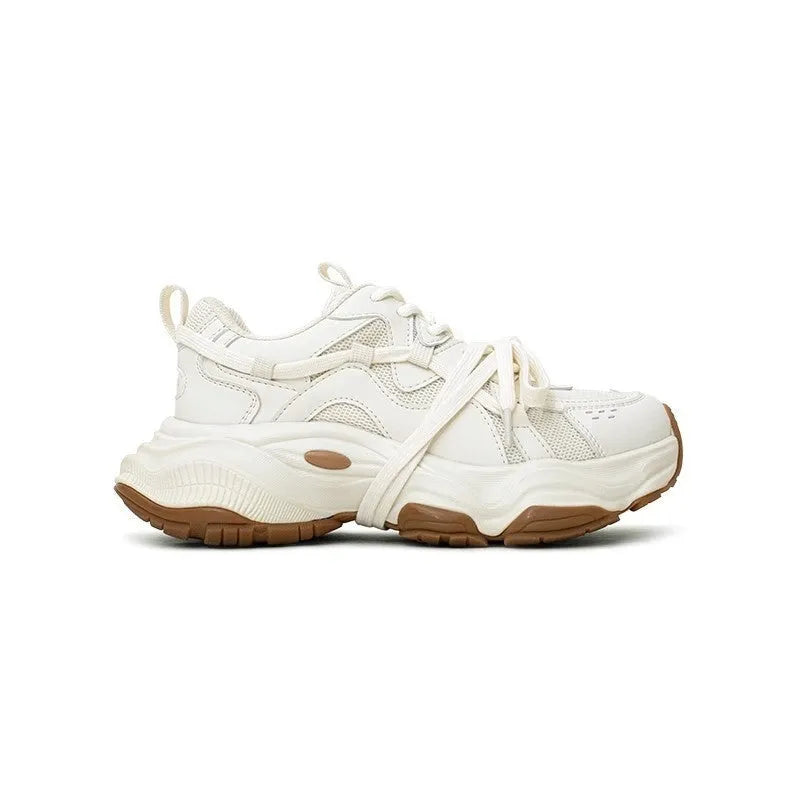 Milky white women's platform heel dad sneakers with round toe and front laces on a solid background.