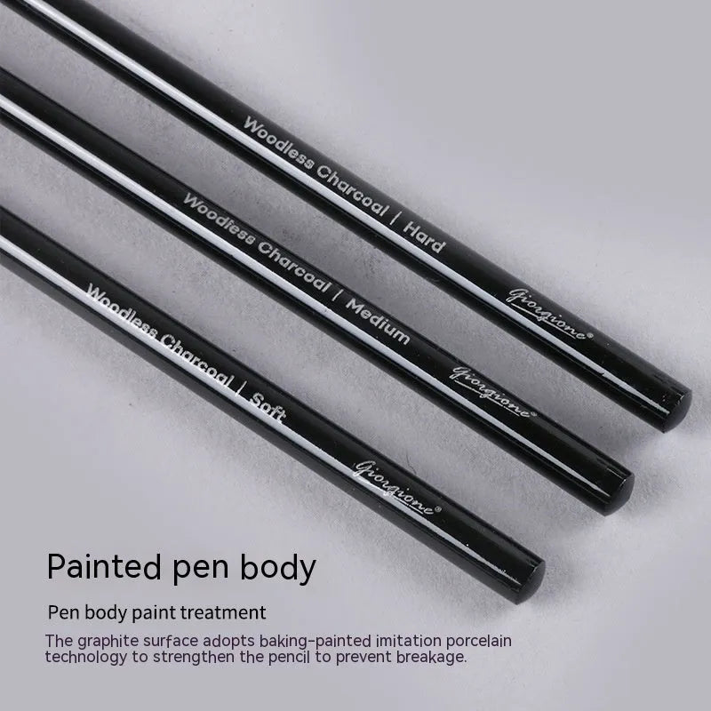 Set of six graphite pencils and three carbonized pencils with wooden shells on suction card packaging