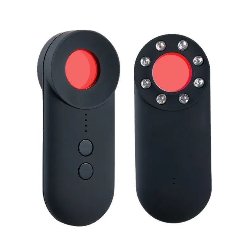 Black portable GPS and hidden camera detector with USB charging cable on a grey background.
