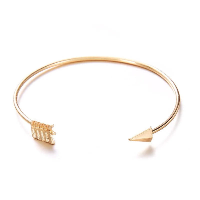 Women's gold vintage cuff bracelet with knotted arrow design in electroplated alloy