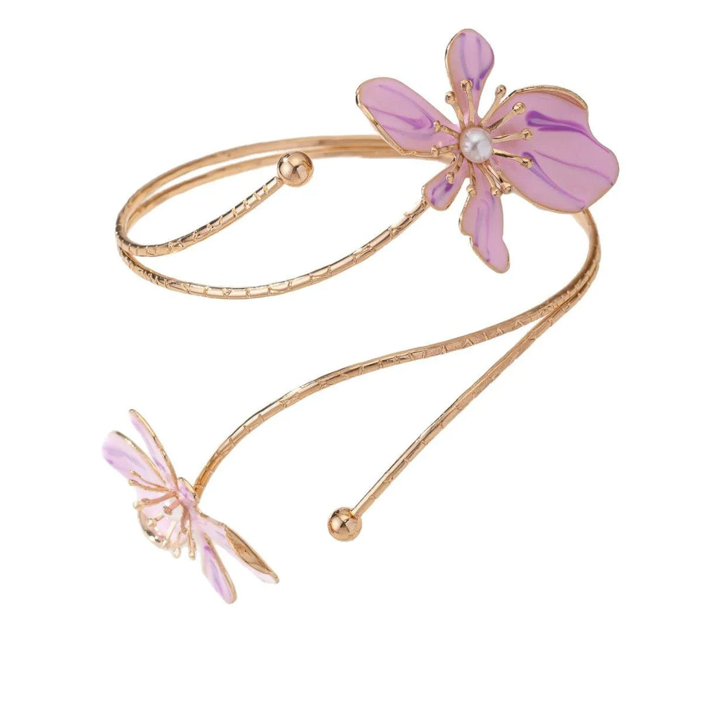 Pink and purple adjustable alloy hollow pattern armband on a wrist.