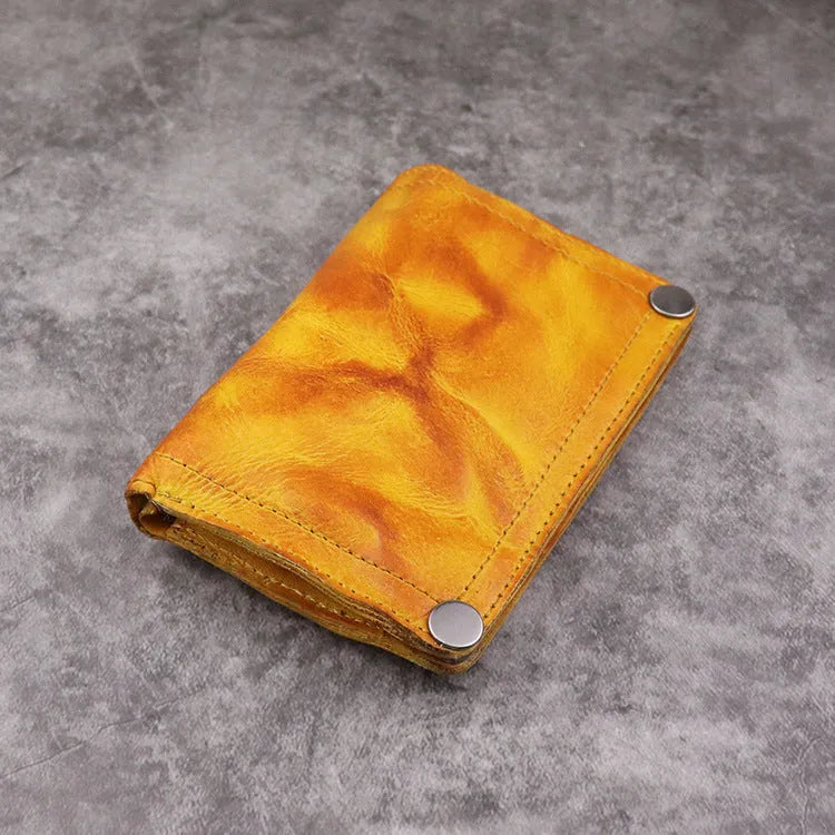 Men's retro brown genuine leather vertical wallet open showing card slots and coin pocket.