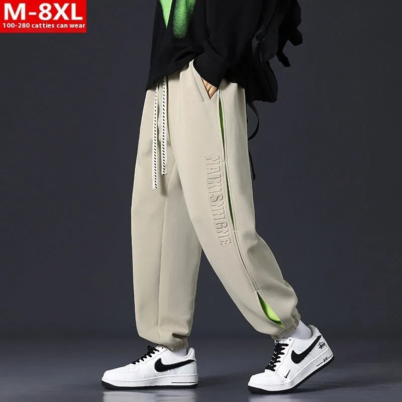 Men's loose cotton trousers with elasticated ankle bands and collage stitching details in khaki colour