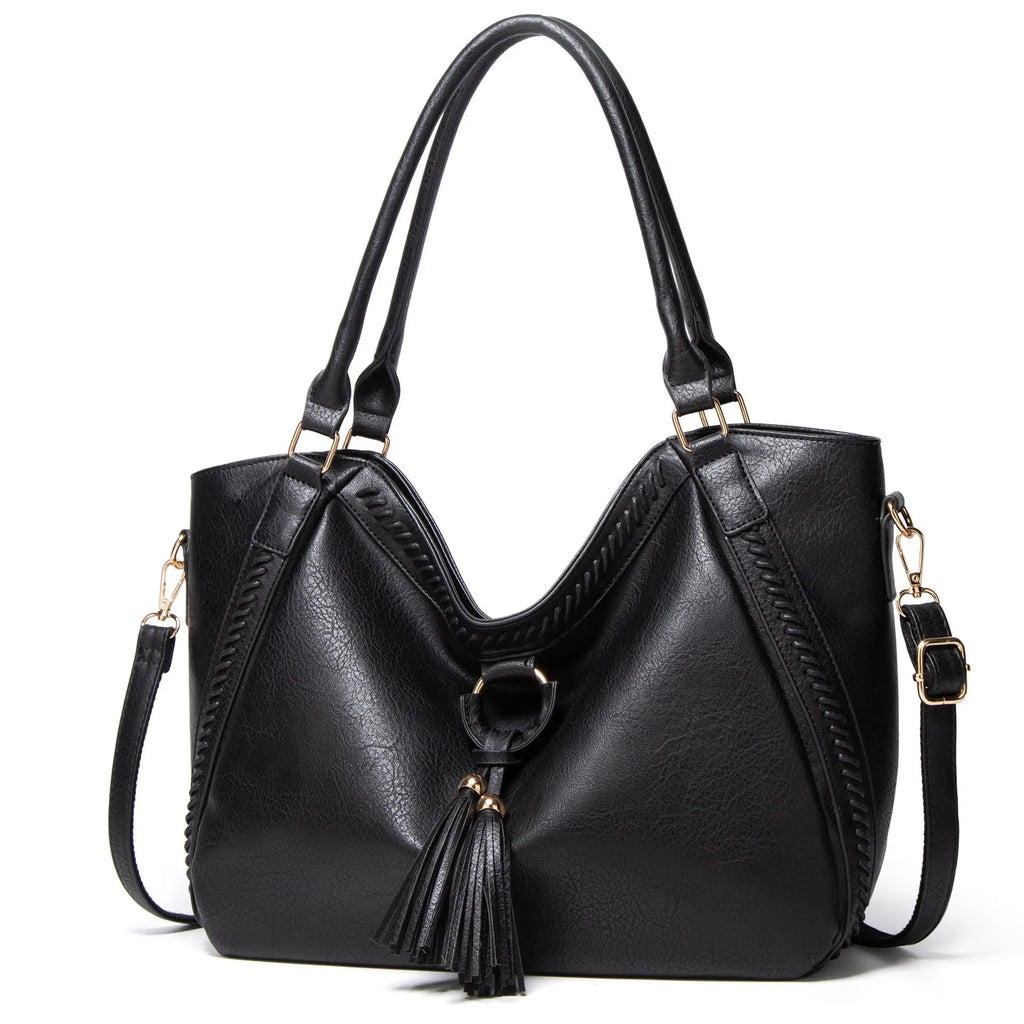 Women's retro PU leather bucket shoulder messenger bag in brown with small bag, placed on a neutral surface showing front view and strap.