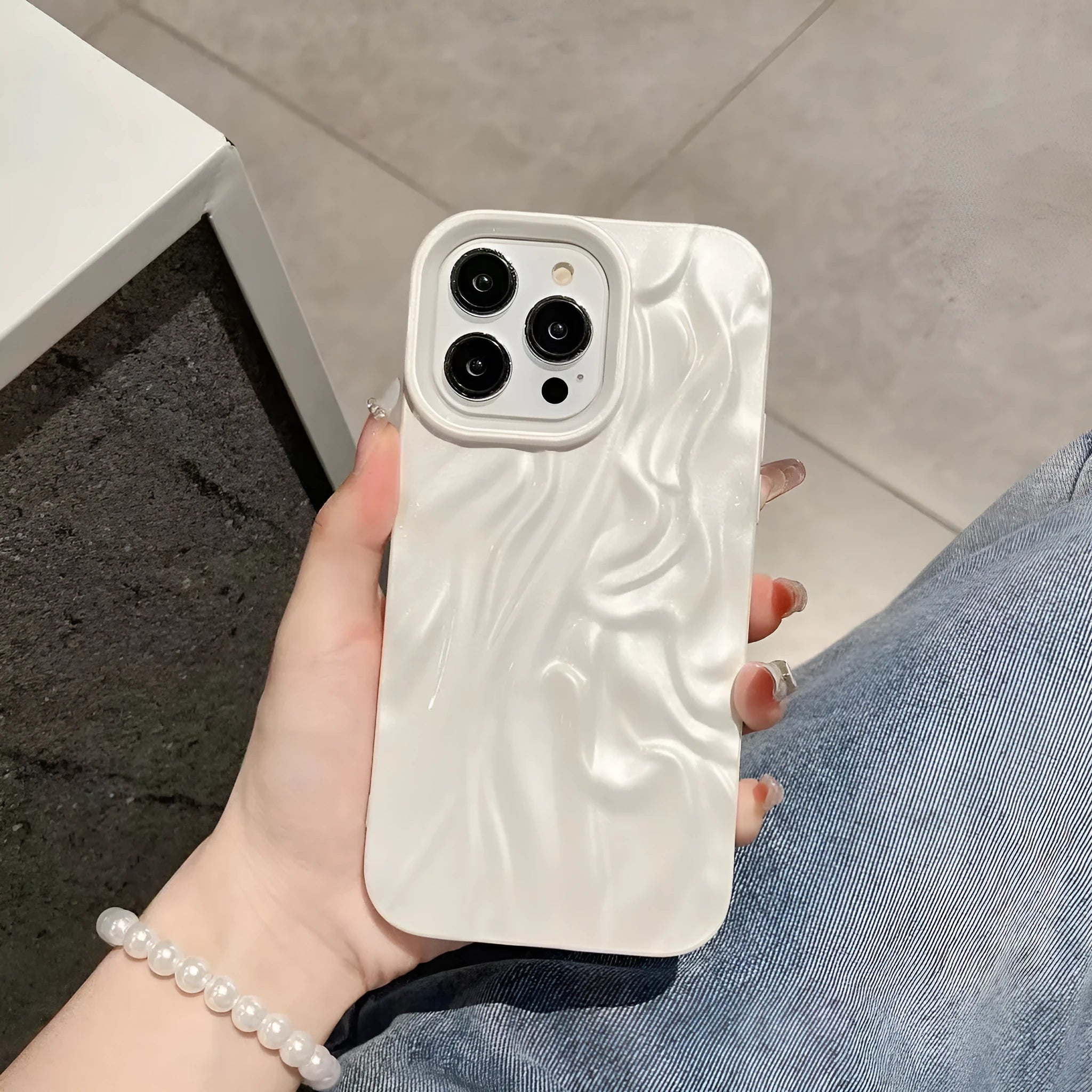 Solid colour water ripple silicone case for iPhone on a white background.