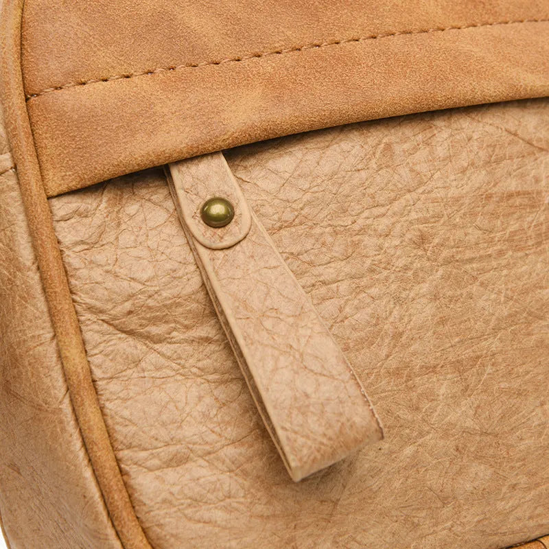 Men's retro style paper crossbody bag in black, brown, and silver colour options.