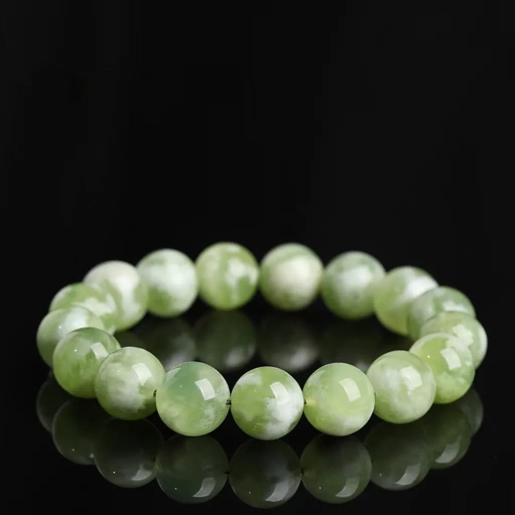 Green milk-in-water Xiuyan jade bracelet with geometric beads in single circle design