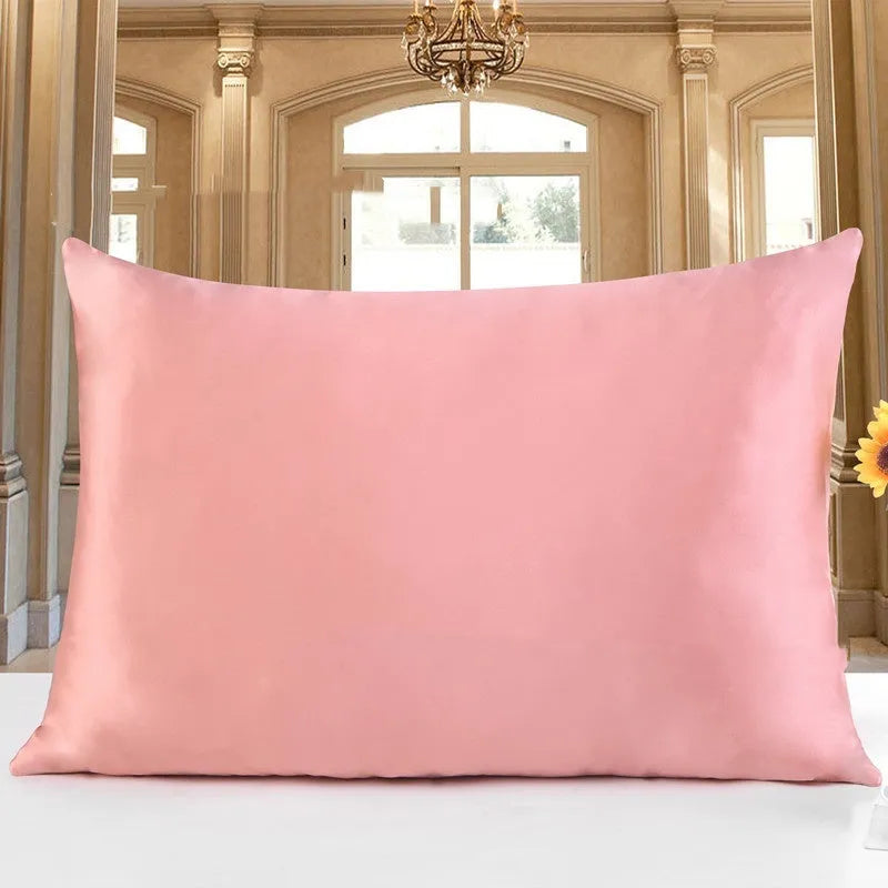 19 M double-sided silk pillowcase shown in one of 14 available colours, including apricot, sky blue, and black.