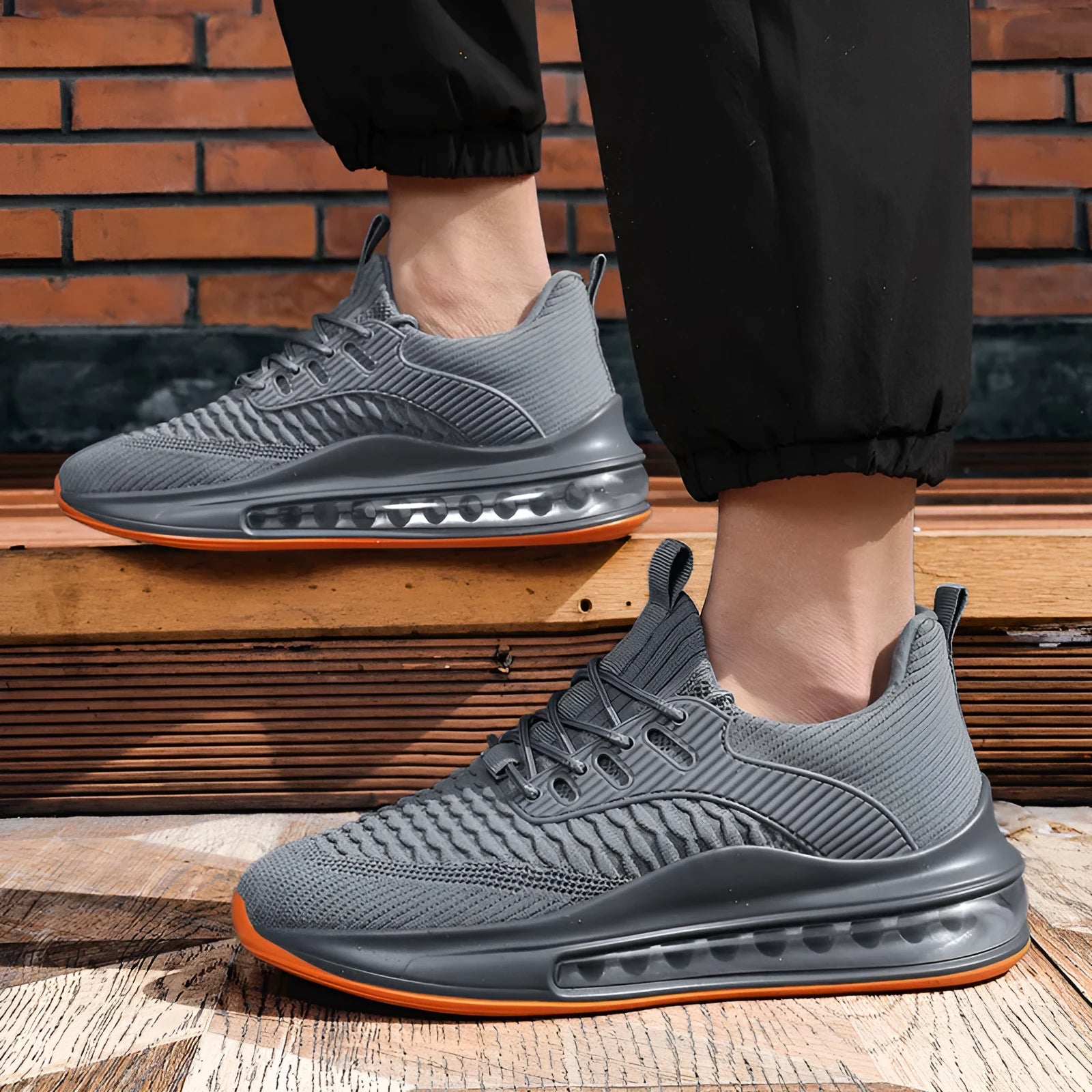 Men's black mesh running shoes with lace-up front and rubber sole on a white background