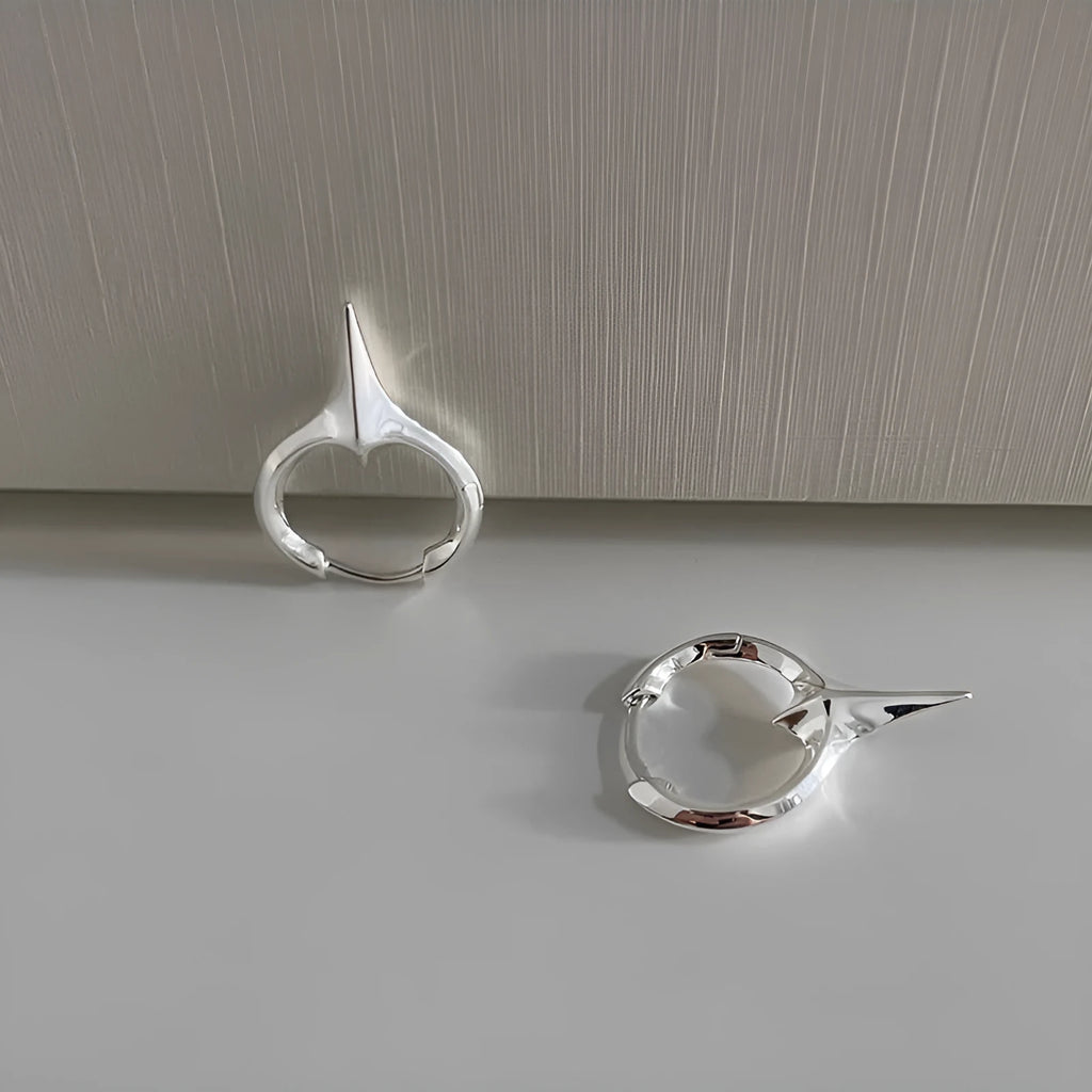 Geometric star-shaped ear clips for women with copper construction and white gold electroplated finish