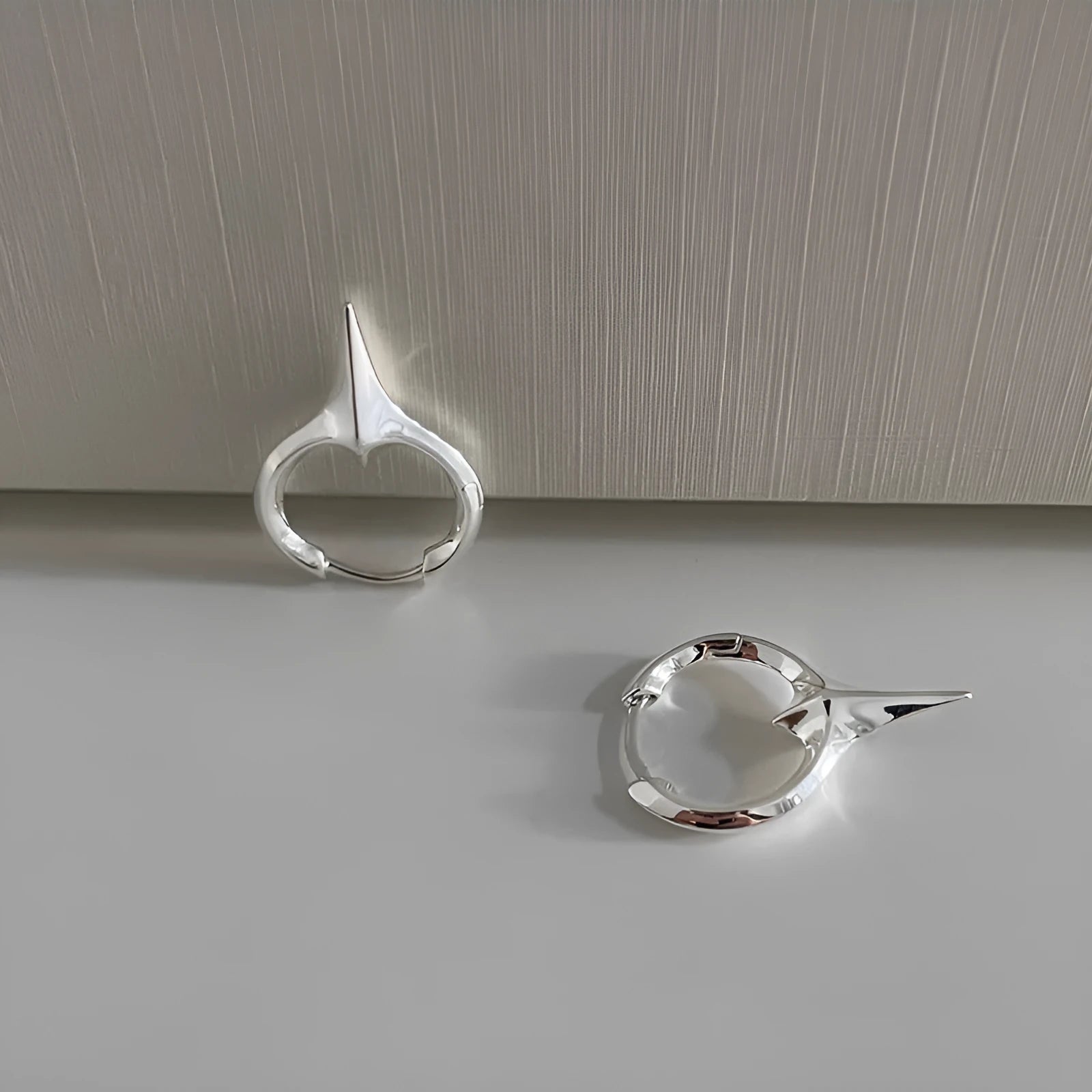 Geometric star-shaped ear clips for women with copper construction and white gold electroplated finish