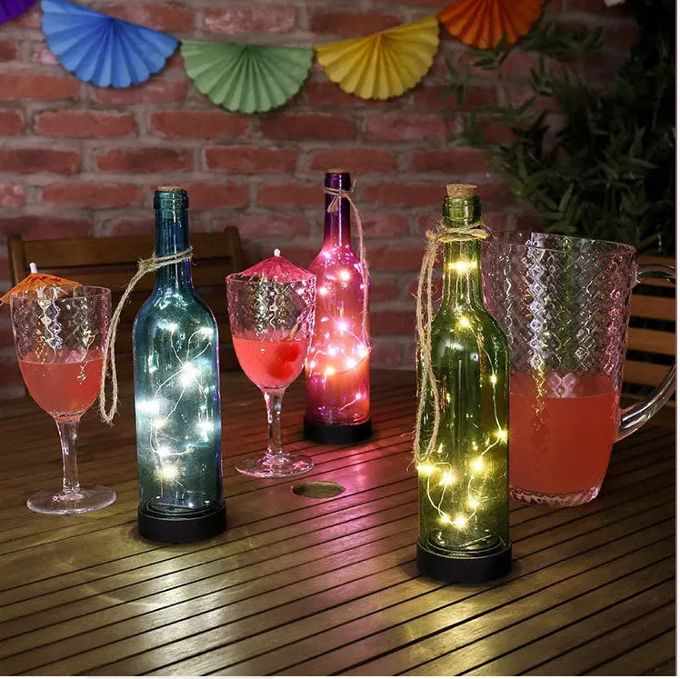 Copper wire LED fairy light string with 20 small button lights and a white plastic battery box.