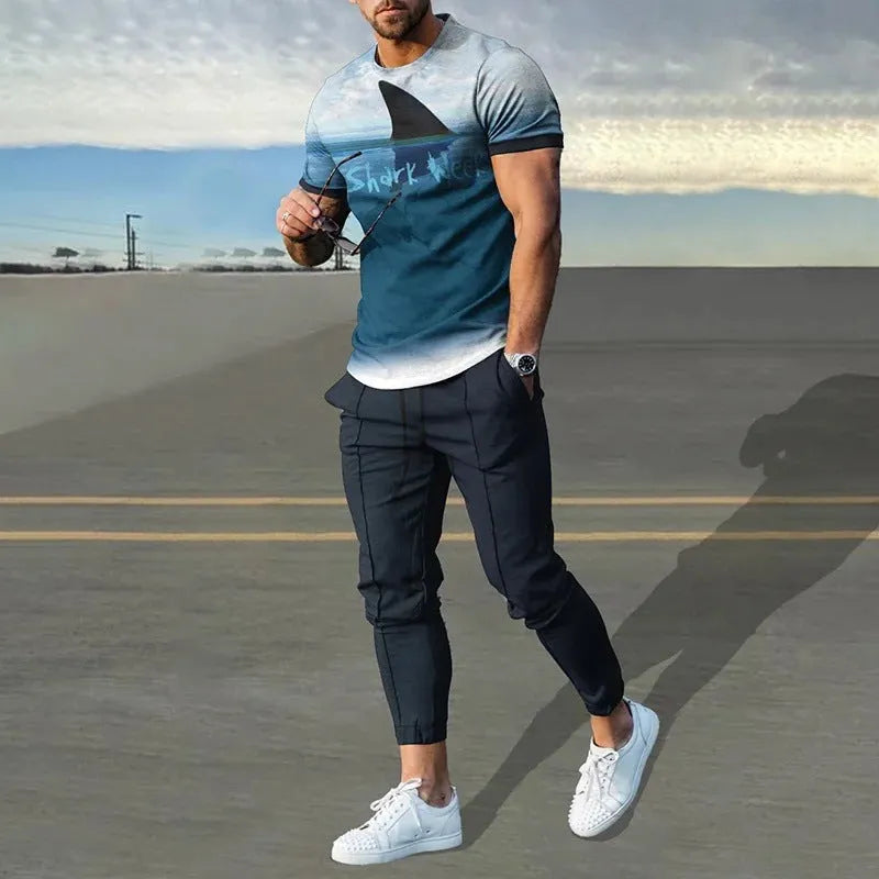 Man wearing a short-sleeved printed pullover and matching trousers from a lightweight polyester casual set.