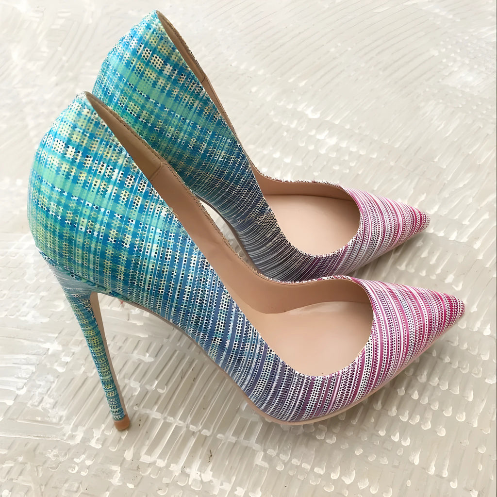 Ladies' pink and blue gradient patent leather pointed toe stiletto heels on a white background.