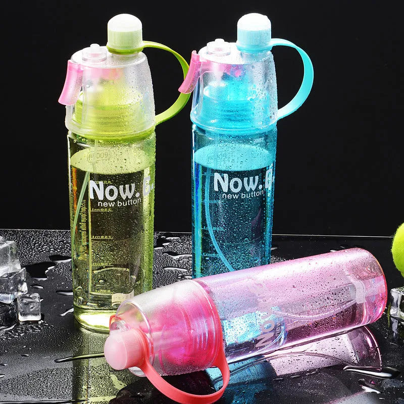 Portable outdoor sports mist spray cup with handle, transparent body showing scale markings, and spray mouth
