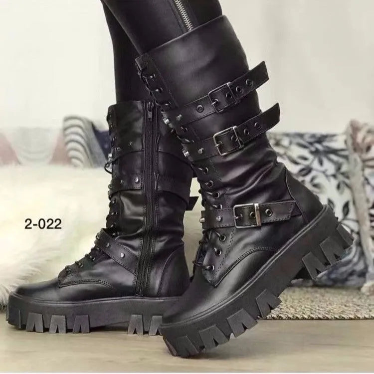 A pair of women's black mid-calf knight boots with a side zip and a large metal buckle strap.