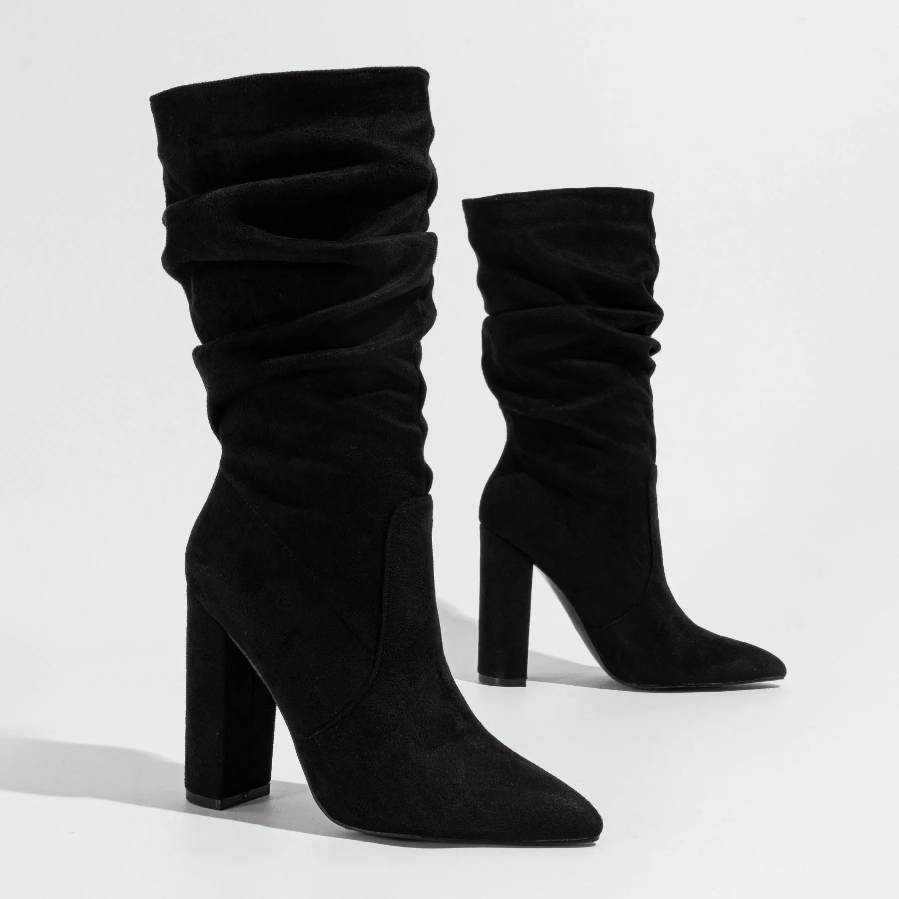Women's black suede ankle boots with chunky high heel and pointed toe design