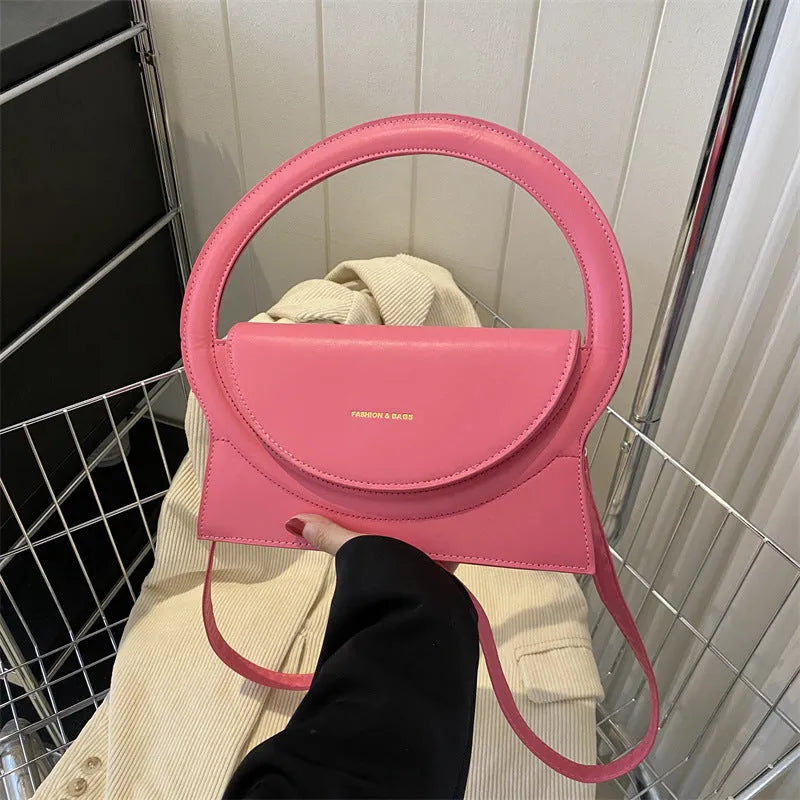Horizontal square messenger bag in multiple colours showing stitching details and shoulder strap