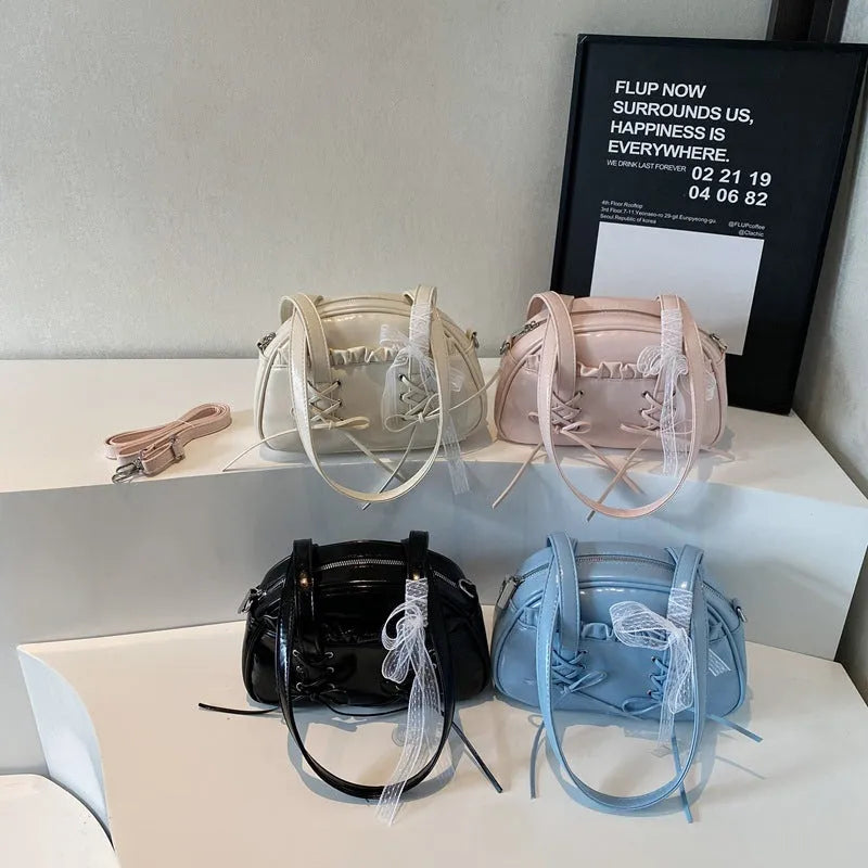 PU leather ladies shoulder bag with bandage bow design and decorative sewing thread in milky white colour