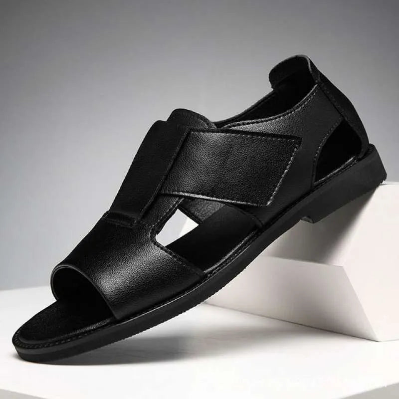 Men's black and brown open-toe leather sandals with a textured rubber sole.
