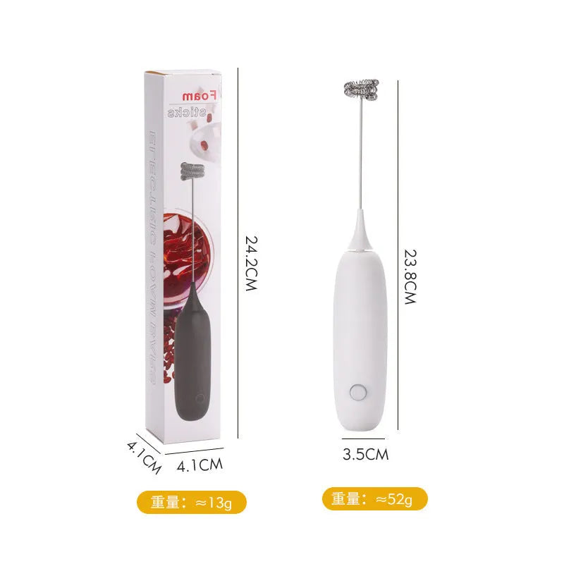 Black and white hand-held electric milk frother blender on kitchen counter