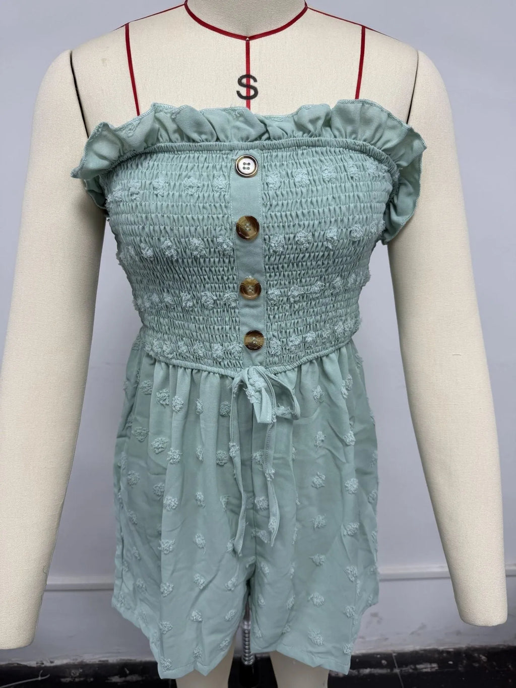 Women's solid colour off-shoulder jumpsuit with button front and sleeveless design