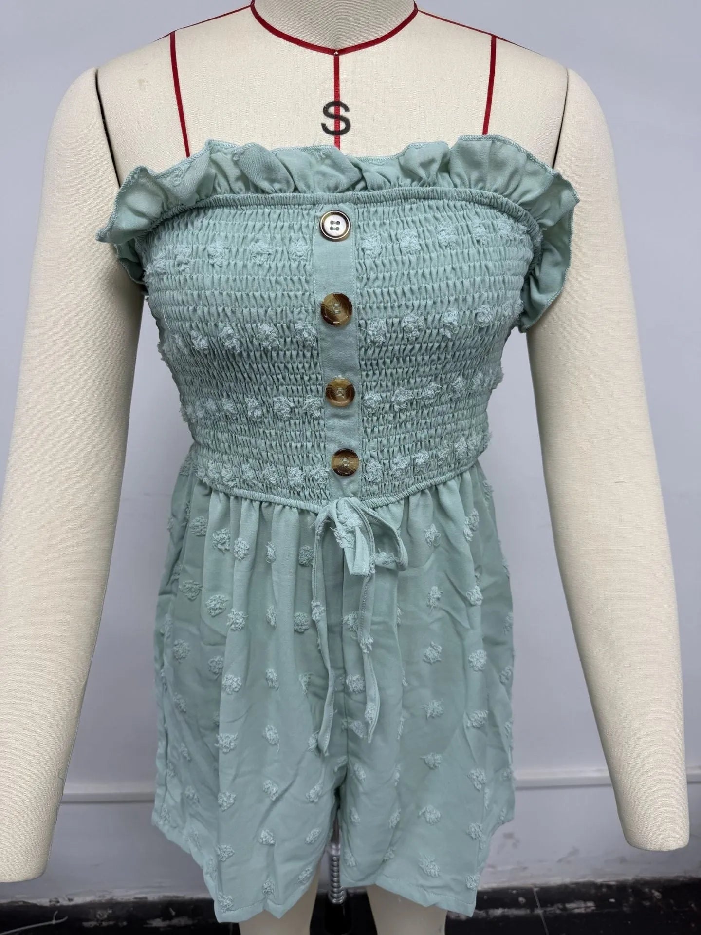 Women's solid colour off-shoulder jumpsuit with button front and sleeveless design