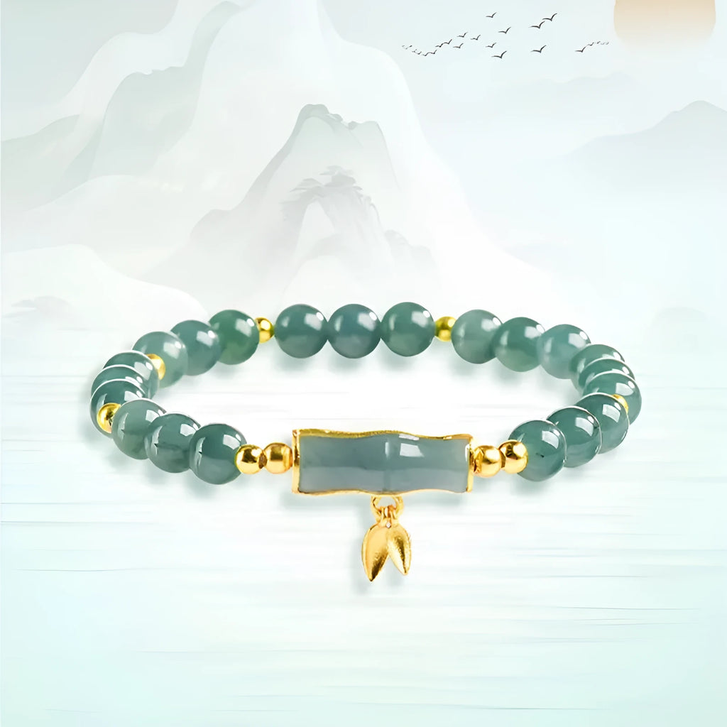 S925 silver bracelet with natural A cargo jade and blue round beads on a wrist.