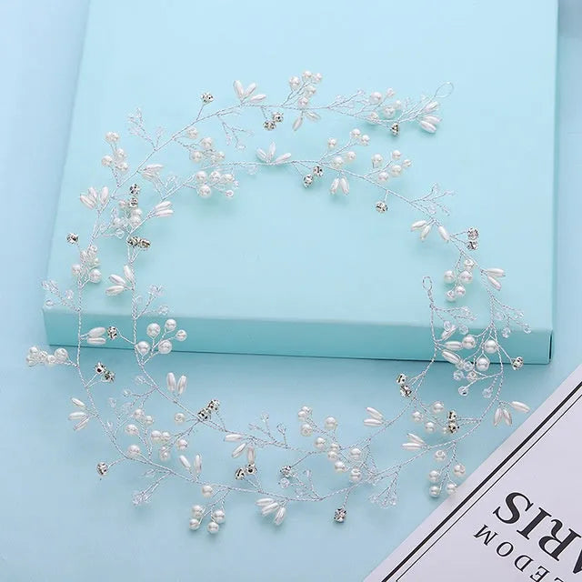 Bride's crystal pearl wedding hair band accessory in silver, gold, and rose gold colours with wired construction