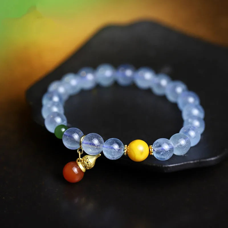 Women's aquamarine crystal bracelet with 8mm geometric beads in transparent iced blue colour