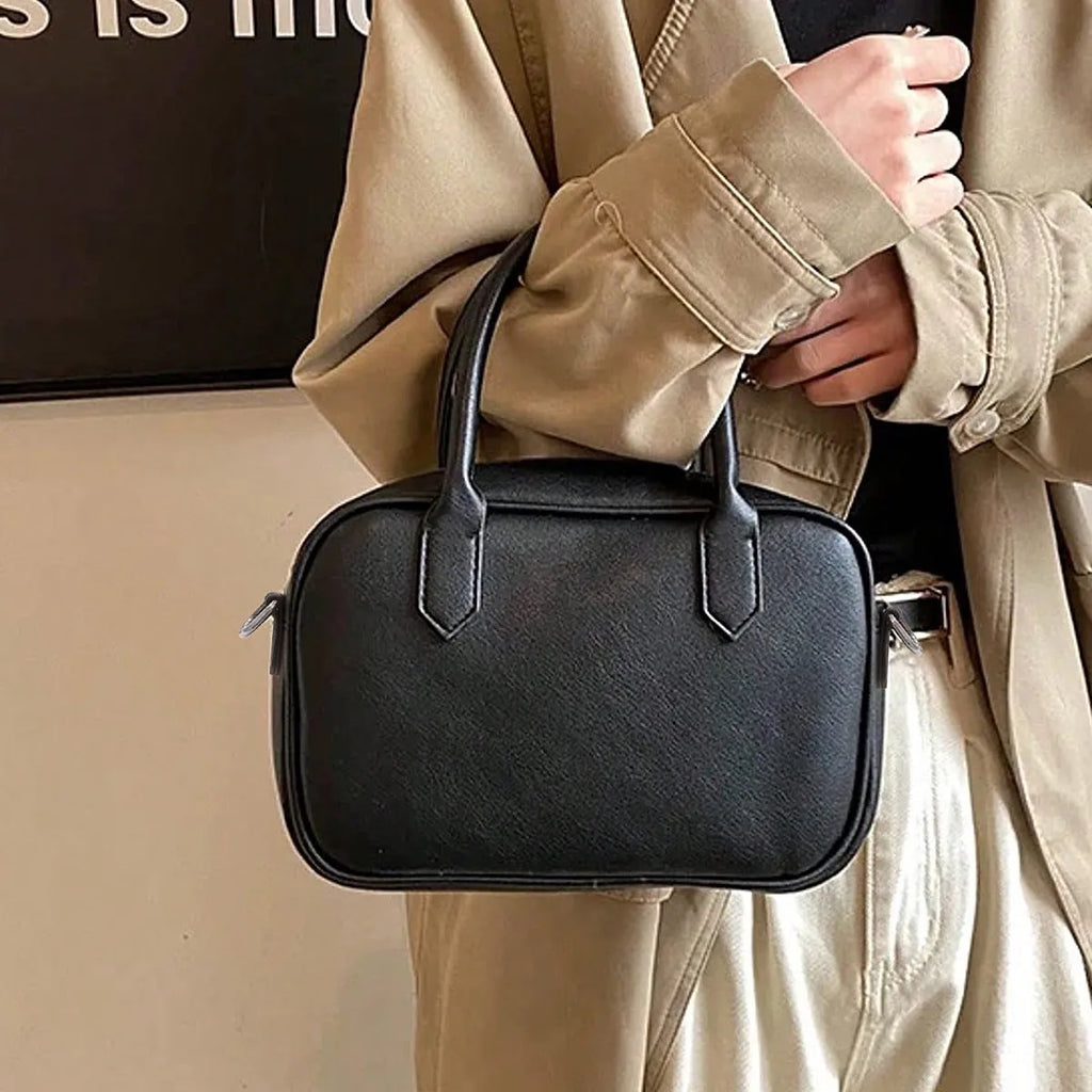 Retro square shoulder messenger bag in black PU leather with a single strap.