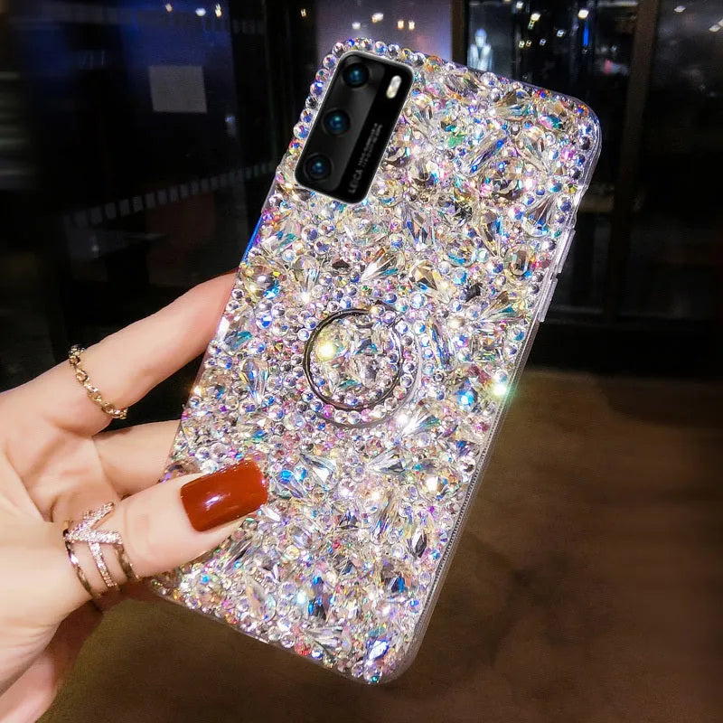 Sparkling diamond acrylic phone case for Samsung Galaxy phone on a table.