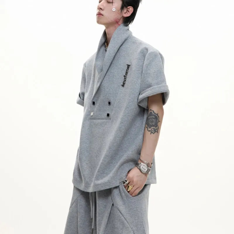 Man wearing a dark grey V-neck padded shoulder short sleeve jacket and matching shorts, a cotton sports suit set.